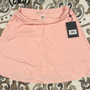 Gfore golf skirt/shorts with zipper pockets.